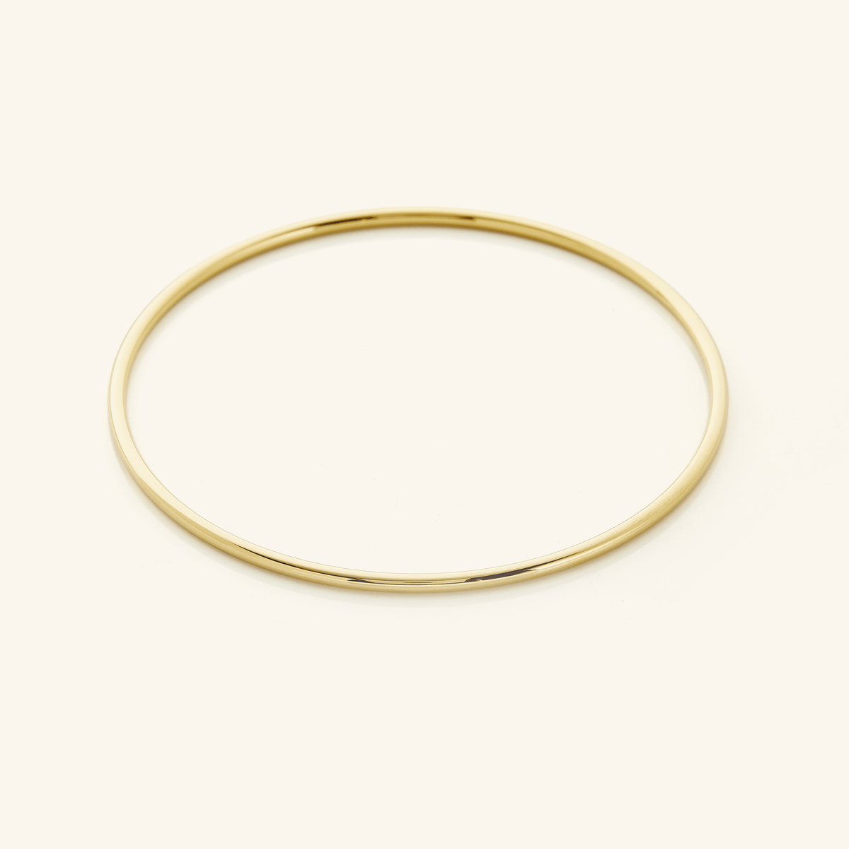 Picture of a thin gold bangle.