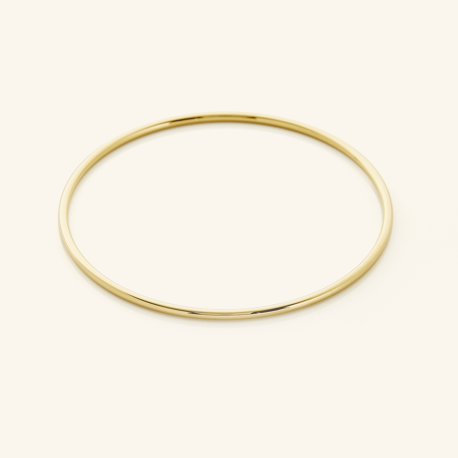 Picture of a thin gold bangle.
