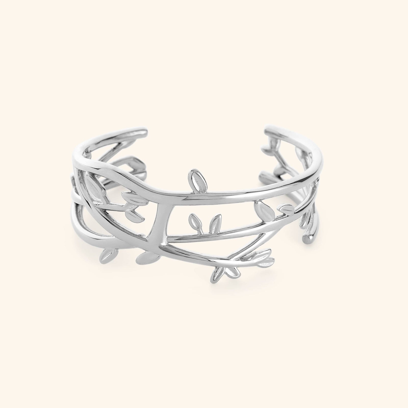 Silver Imperfect Olive branch cuff on a light background