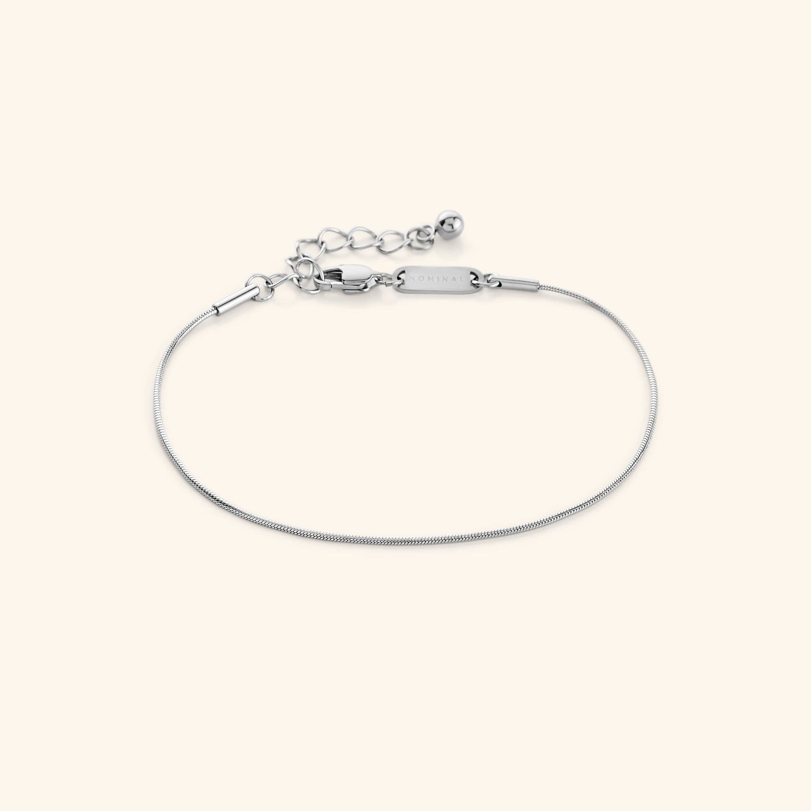 Photo of the silver Micro Harmony Bracelet against a light background. This bracelet  features a 1MM seamless snake-like chain 