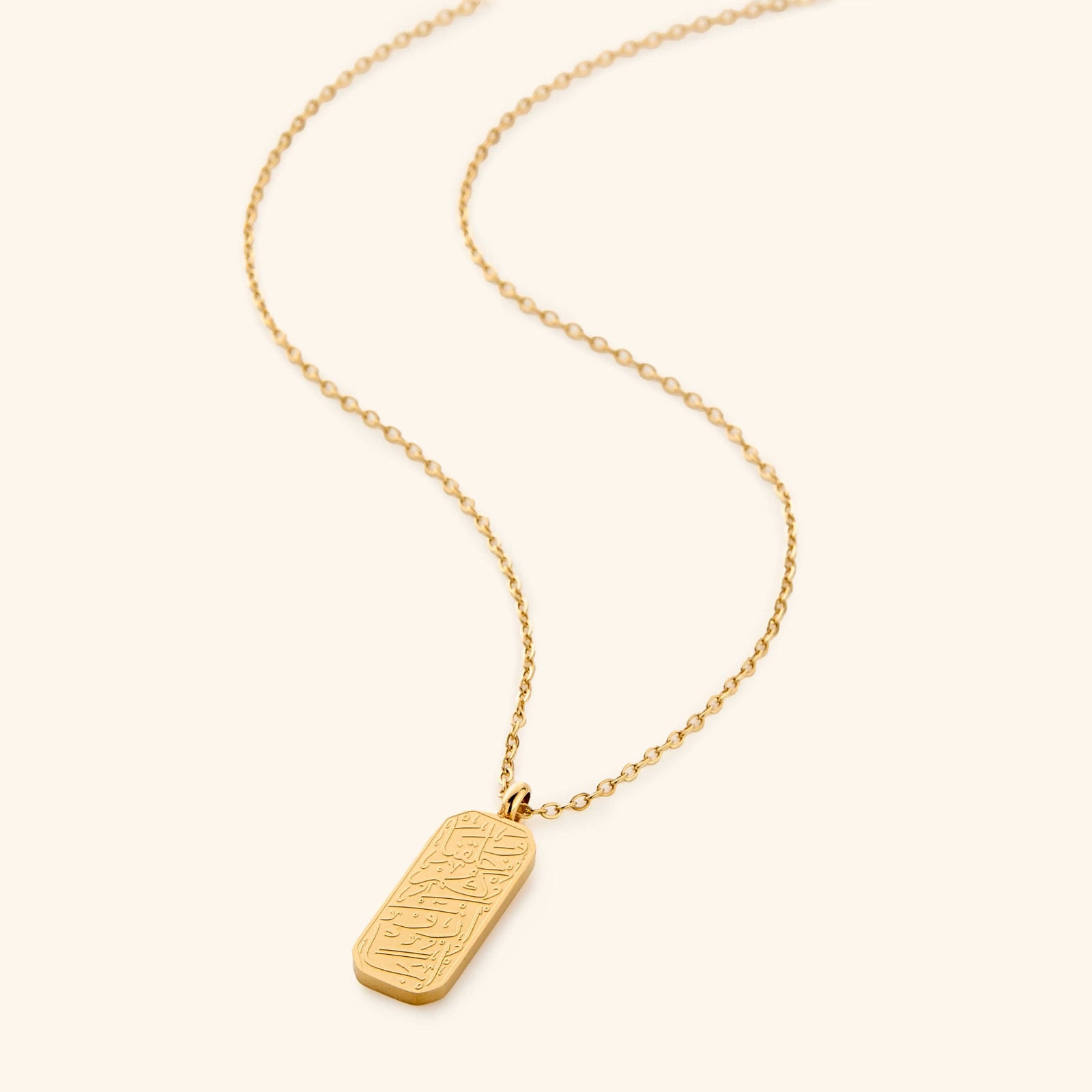 Flat lay of the gold 'And We Created You In Pairs' Necklace.