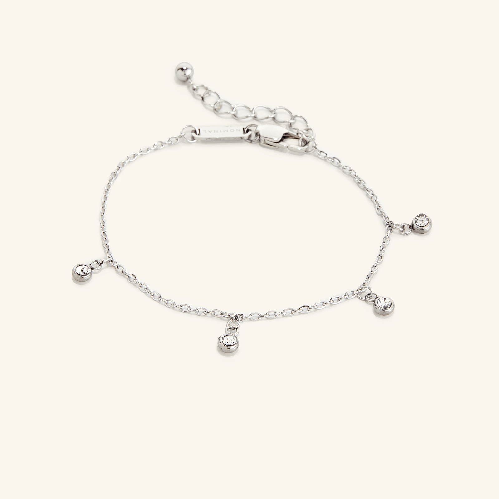 Flat lay of the silver Raining Bezel Bracelet on a light background.