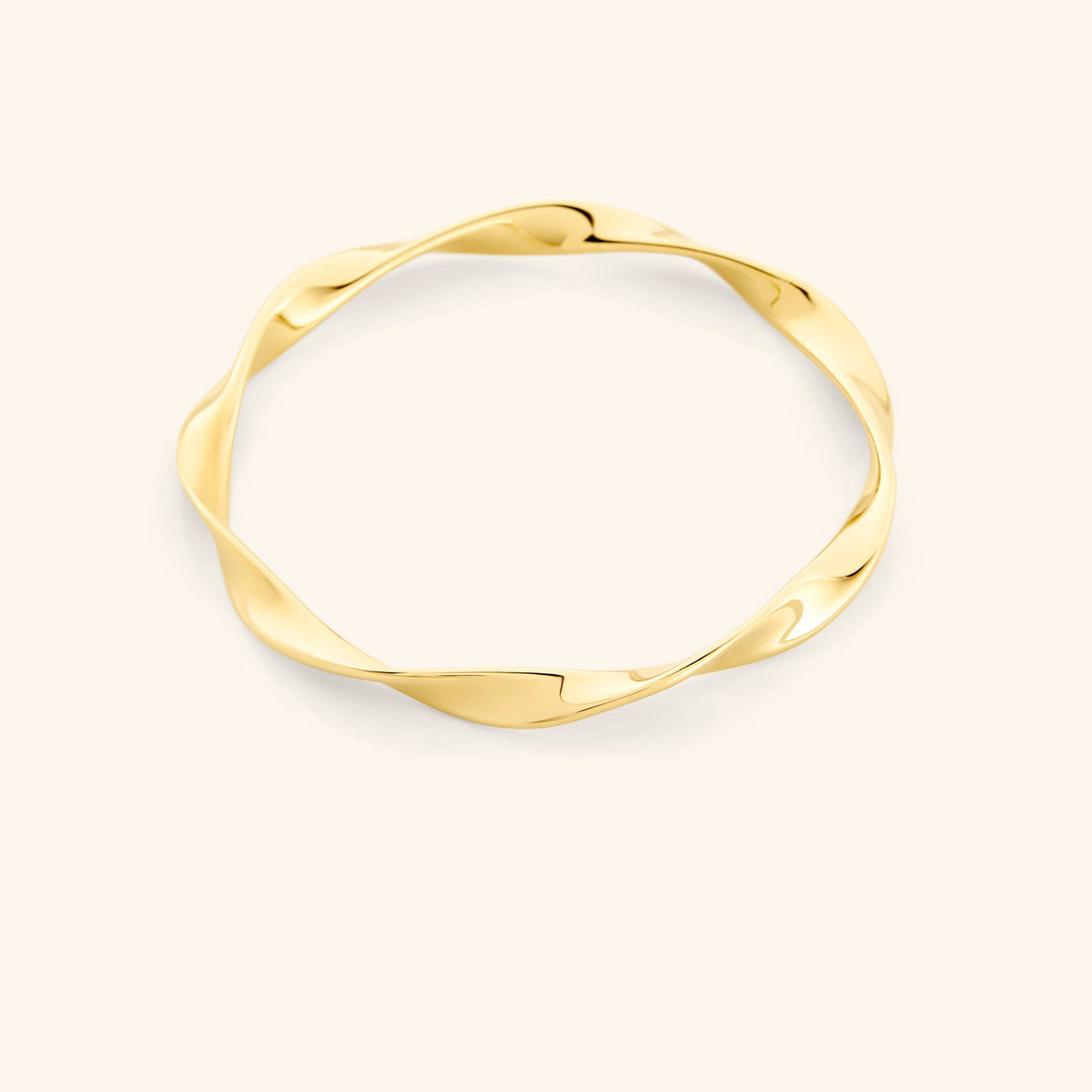 An 18k gold plated bangle that features a design that is inspired by the ripple effect that even a small drop of water can have in an ocean.