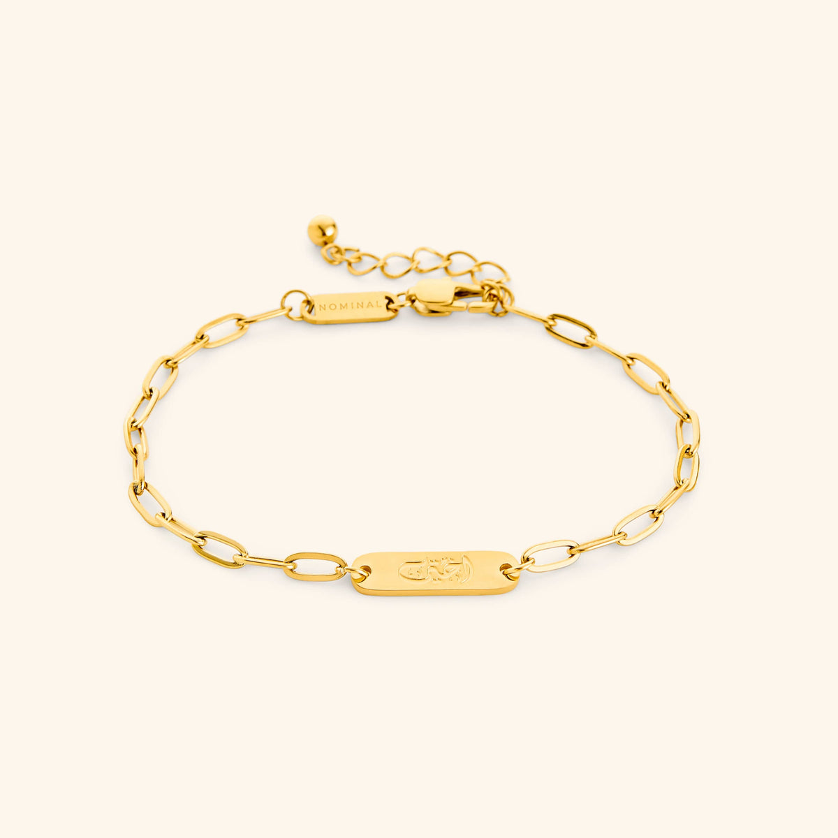 Gold My Sister Ukhti link bracelet showing the Arabic engraving on center tag, photographed against a light background.