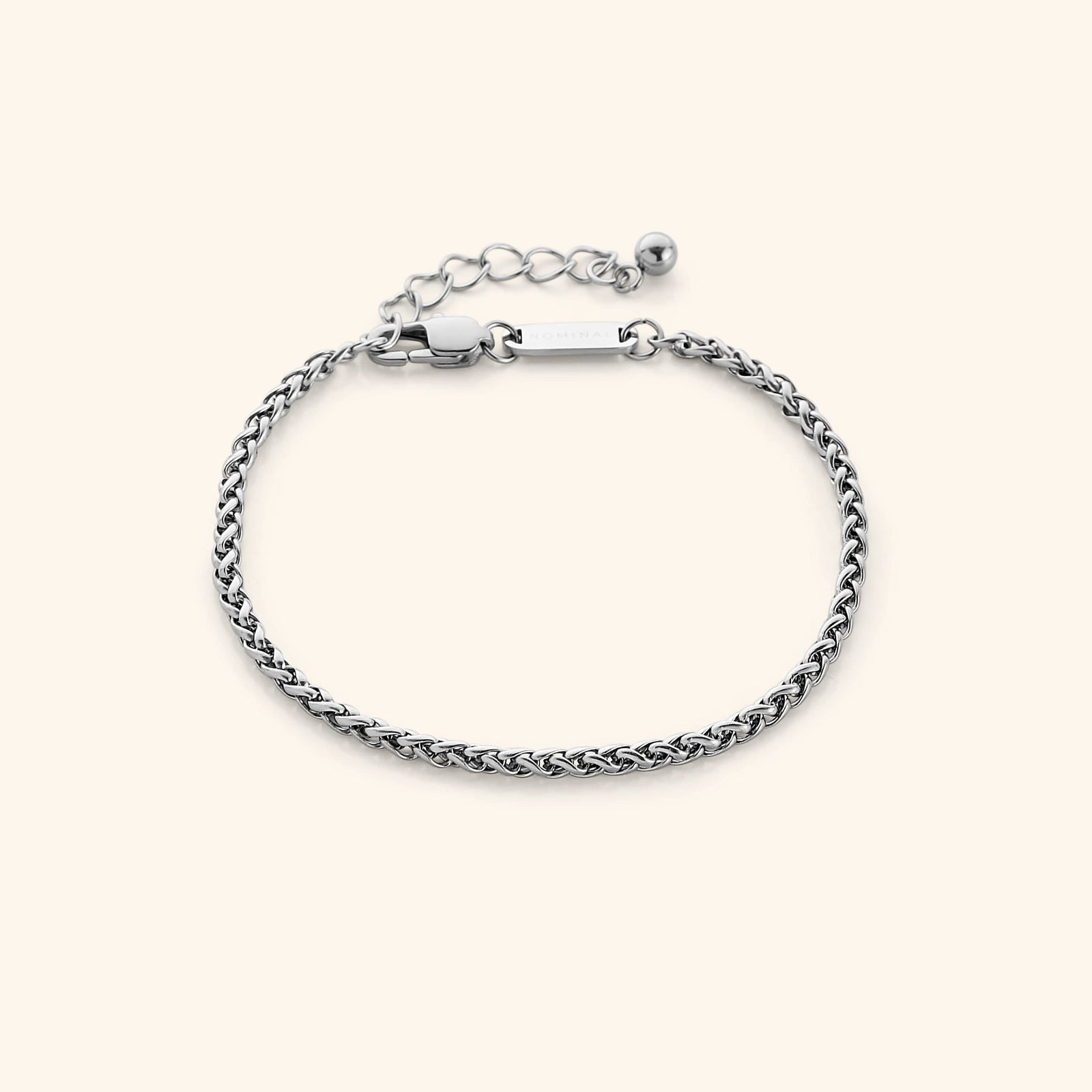 Photo of a silver bracelet that features a smooth woven pattern to give a premium and elegant feel to your daily bracelet.