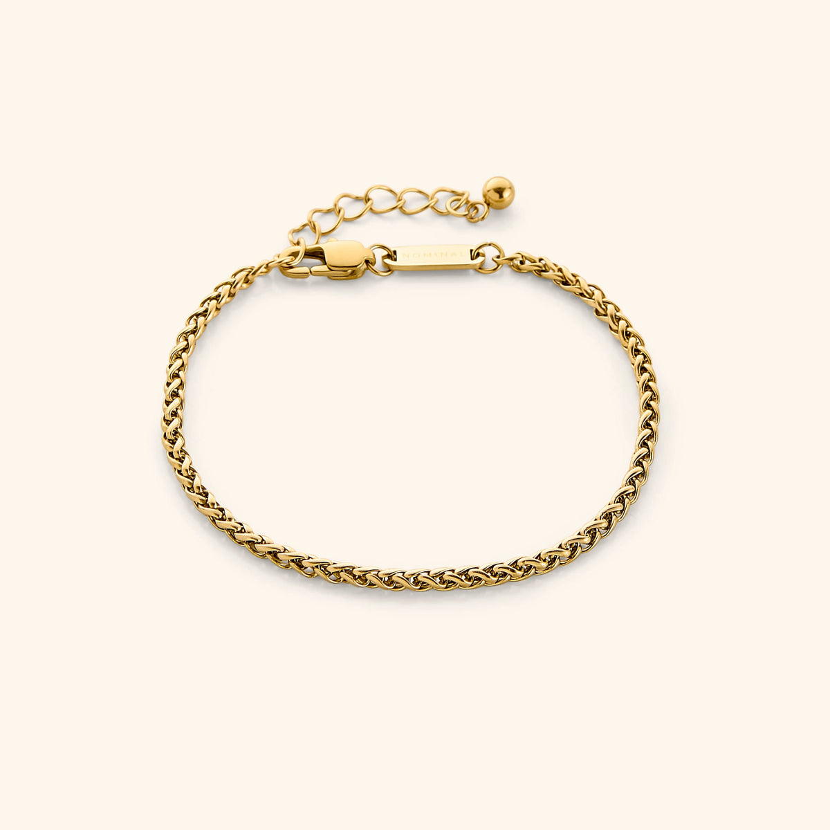 Photo of an 18k gold plated bracelet that features a smooth woven pattern to give a premium and elegant feel to your daily bracelet.