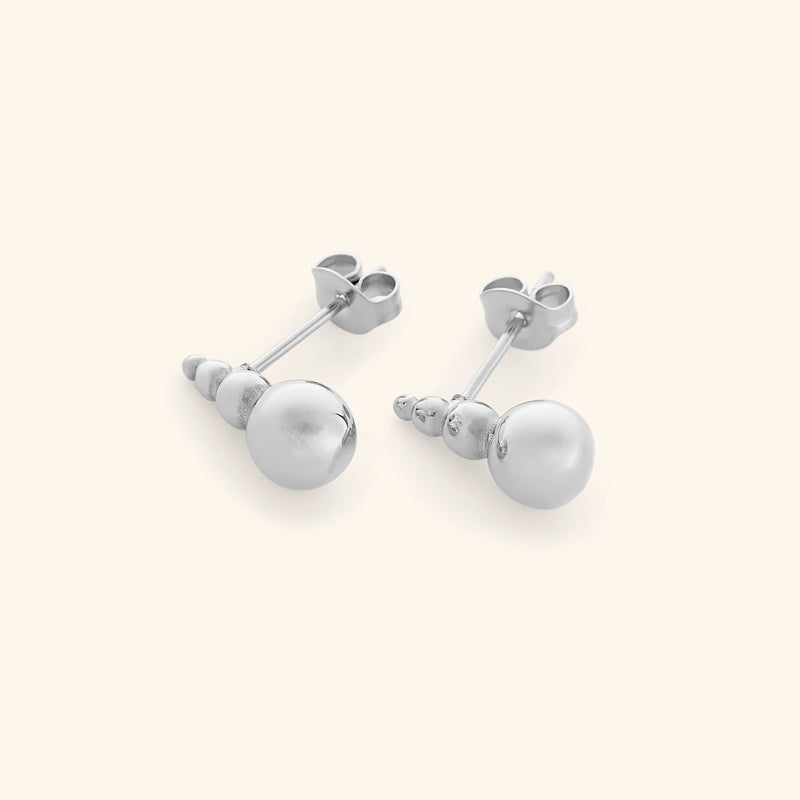 Close-up angled view of the Dotted Studs in silver pimage_ showing polished bead detail.