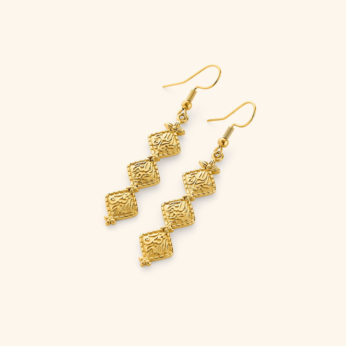 A pair of 18K gold plated earrings with vintage tradition of hammered gold while embossing thikr (the remembrance of Allah) on each diamond-shaped plate design.