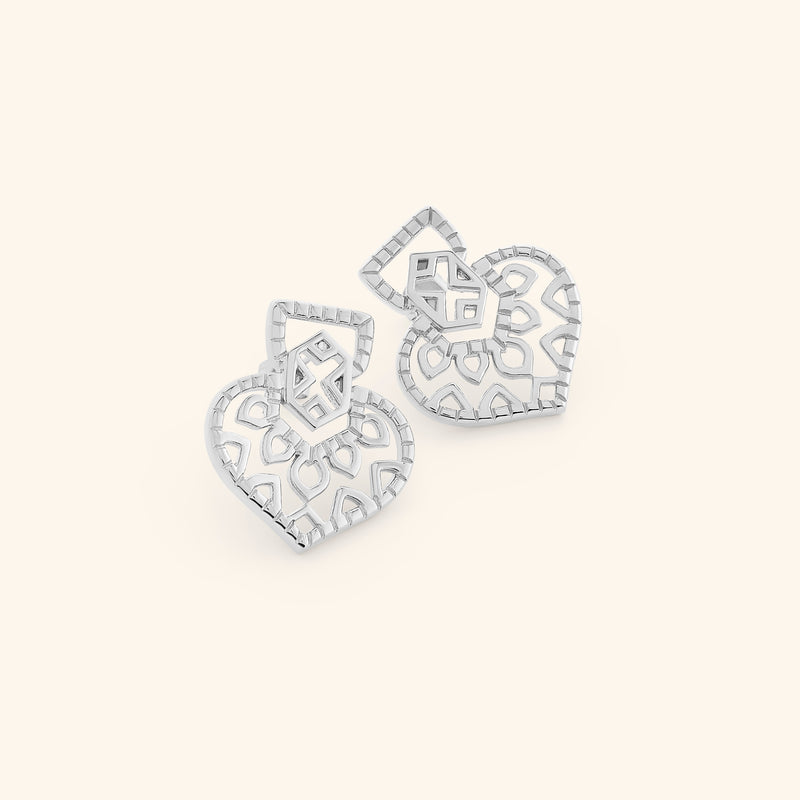 Pair of silver Mehndi Heart Earrings with openwork heart-shaped design and geometric detailing.