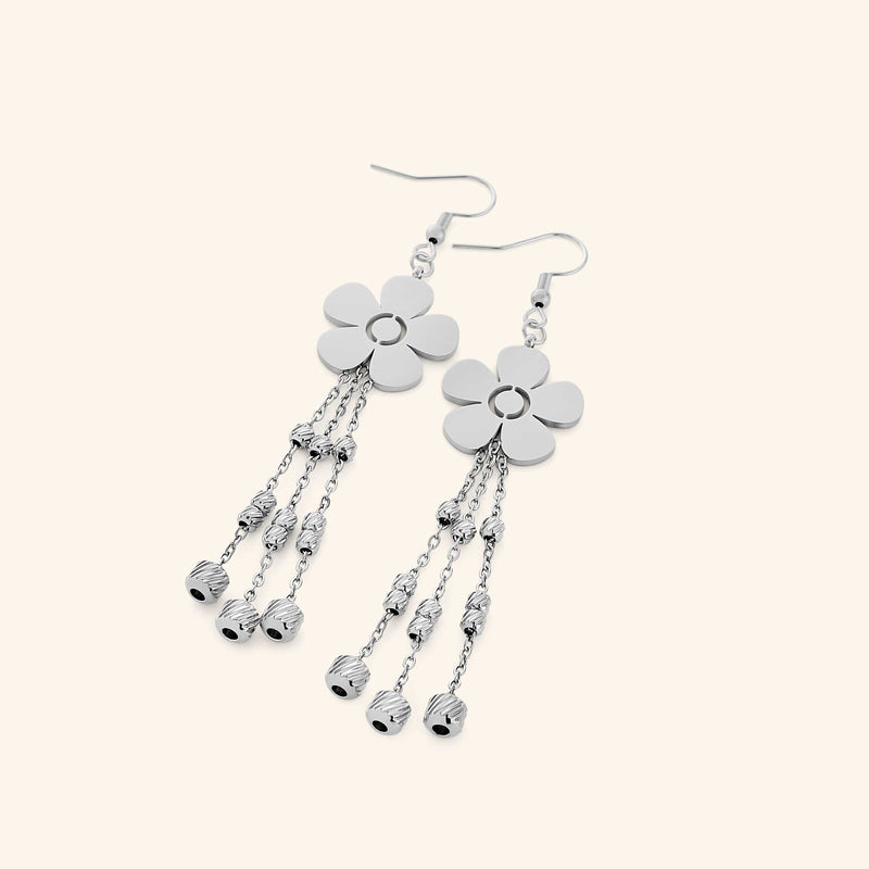 Pair of silver Raining Flower Earrings featuring floral studs with five smooth petals pimage_ suspending three dangling chains with textured silver beads.