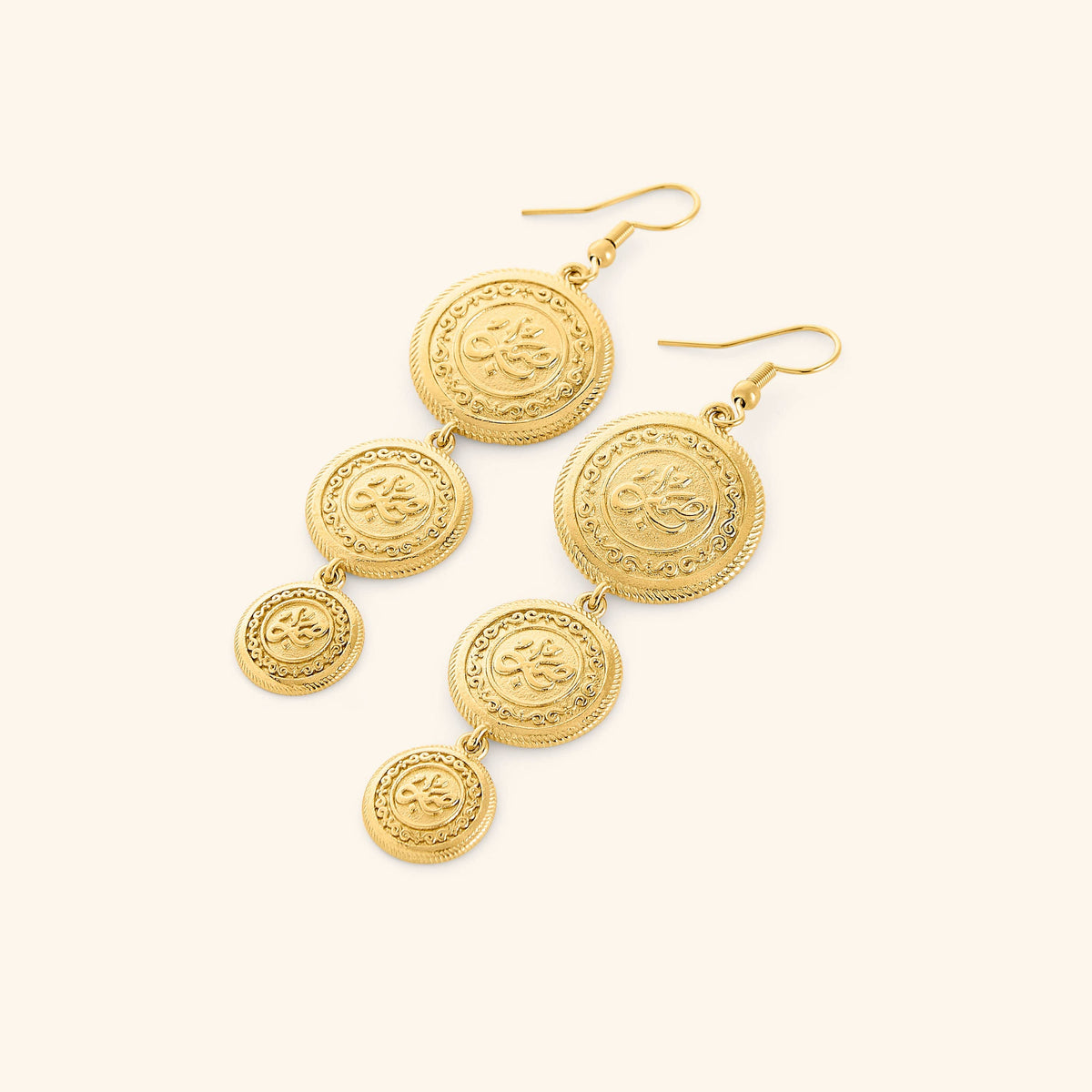 A pair of tri-coin 18k gold plated earrings  embossed with Arabic calligraphy "Sabr". The coins drape from each other with a gold double-chain.