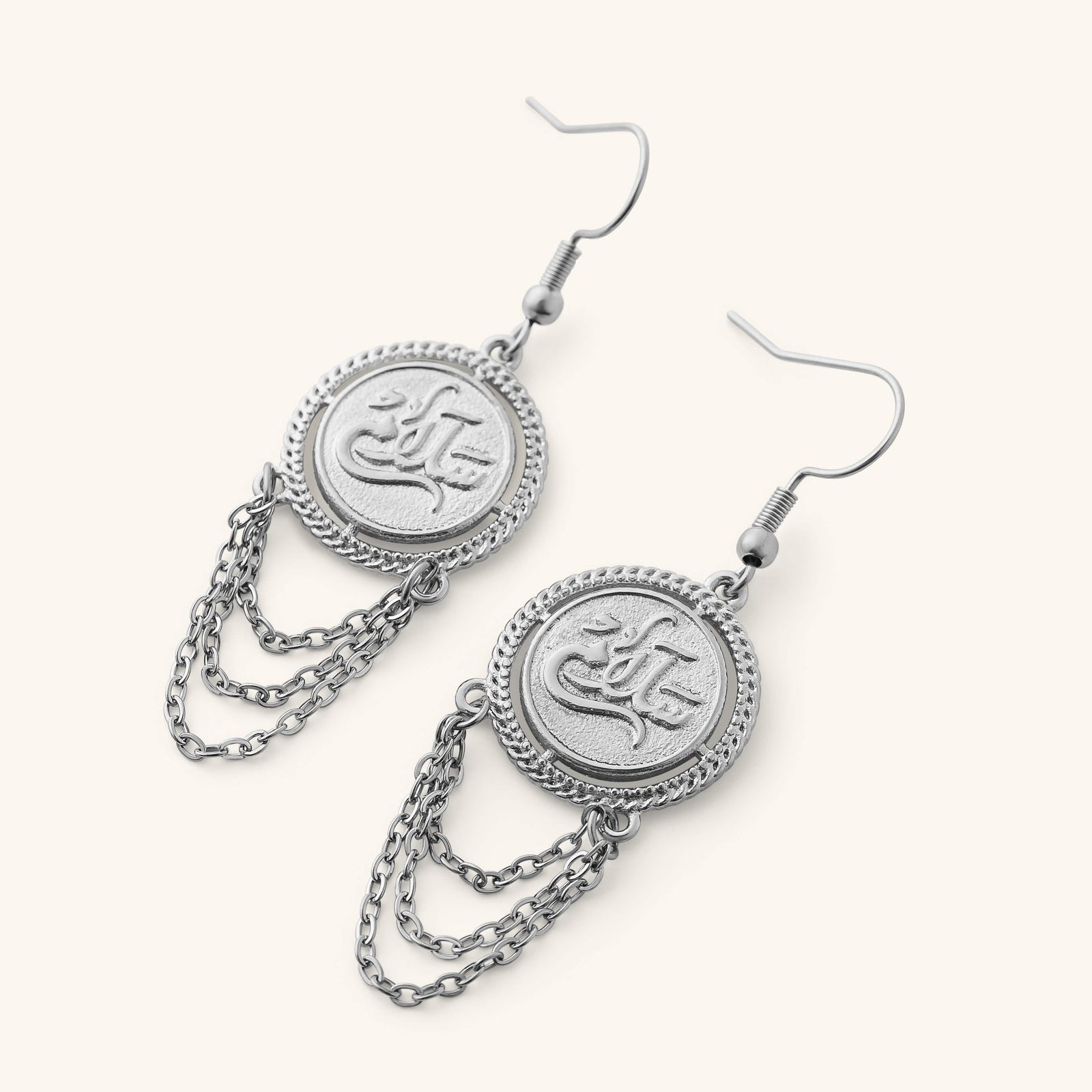 Silver Salam Vintage Token Earrings featuring round engraved Arabic calligraphy discs with layered chain tassels.