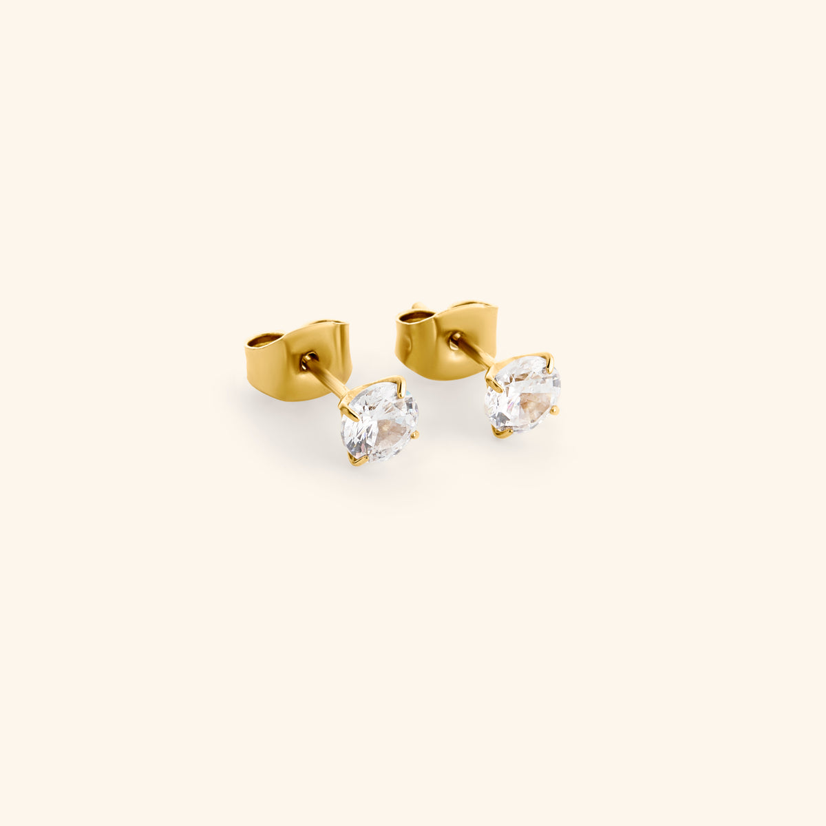 18k gold-plated Tennis Earrings featuring round clear crystals set in a classic four-prong setting.