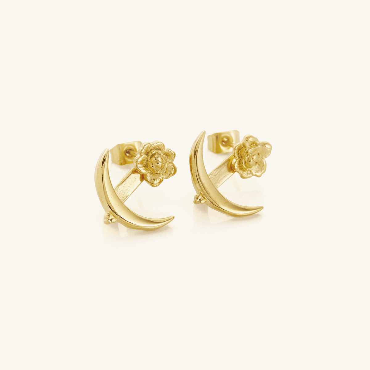 A pair of 18k gold plated earrings that feature a damask rose and crescent shape design.
