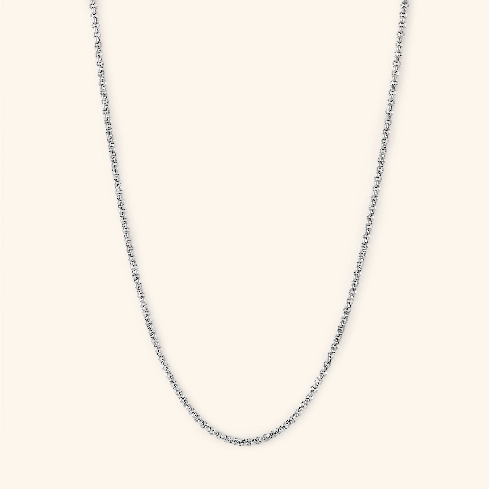 Photo of a silver necklace against a light background. The Invisible Box Bracelet features a 1.5MM alternating box-like chain pattern