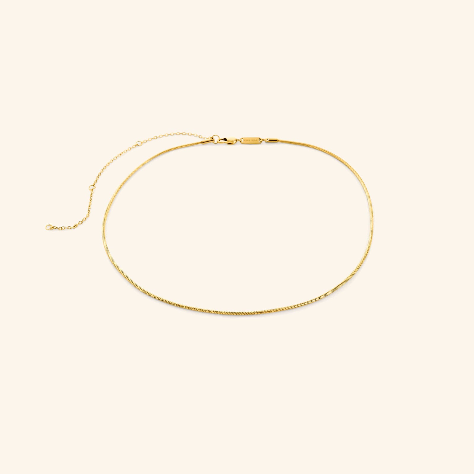Gold harmony necklace on a white background