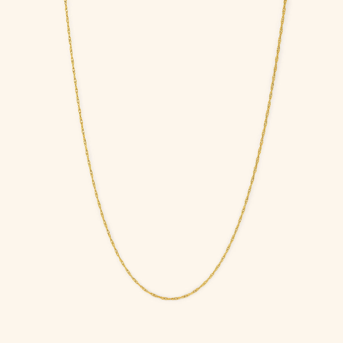 Photo of the gold Micro Twisted Chain. This chain features a 1MM twirling chain pattern 
