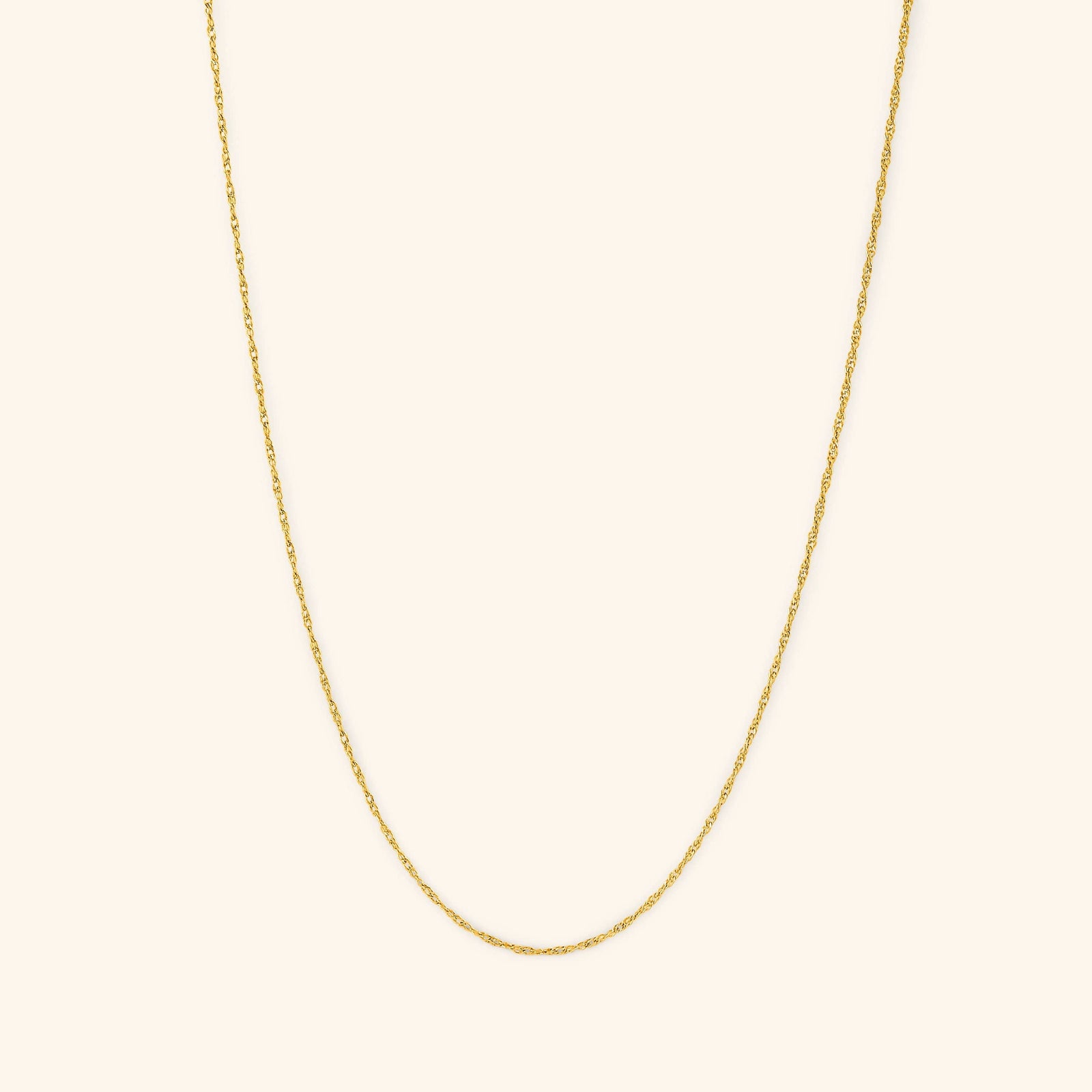 Photo of the gold Micro Twisted Chain. This chain features a 1MM twirling chain pattern 