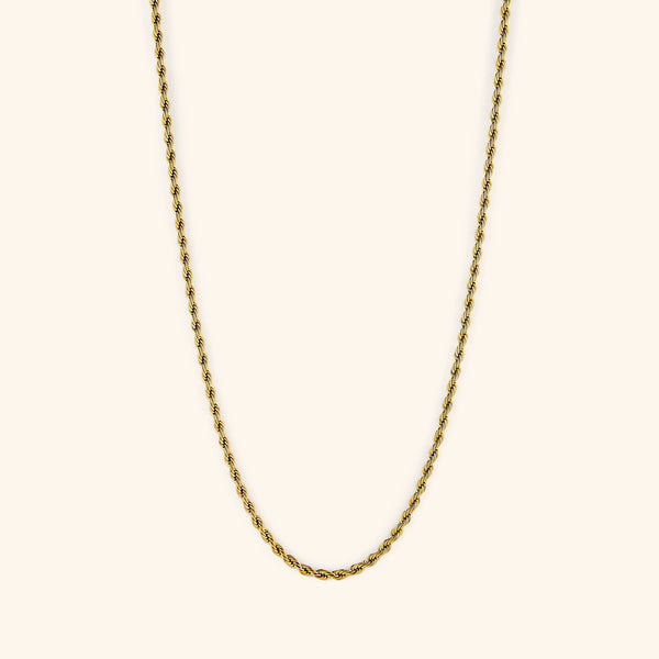 18k gold plated rope chain necklace displayed on a light cream background