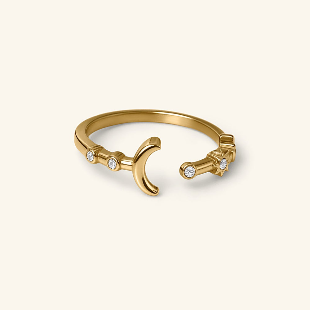 18k gold-plated Crescent Moon & Star Bezel Ring featuring an open band design with a crescent moon and star motif, detailed with round clear bezel-set crystals.