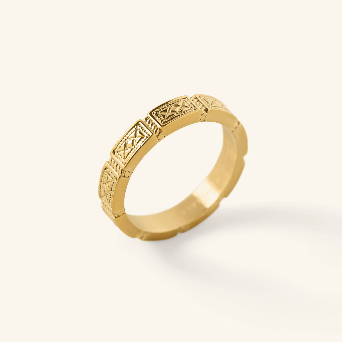 Gold Damascus Tile Ring with repeating engraved tile-style patterns shown against a neutral background.