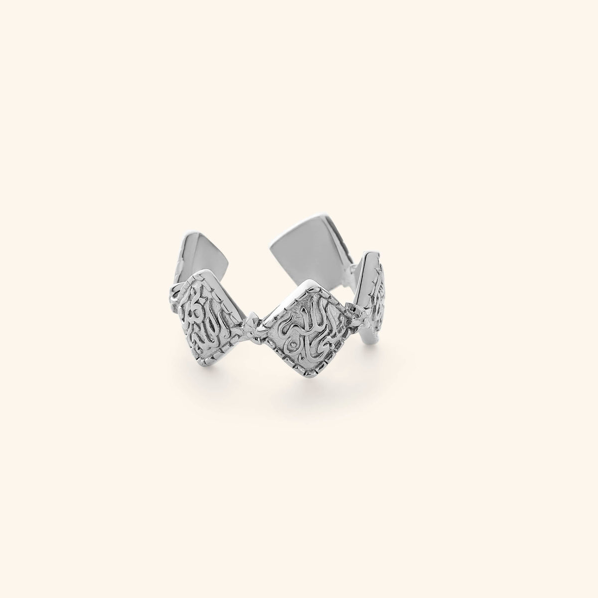 Silver open ring that is designed in a vintage shape of old traditional gold jewelry with each diamond-shaped plate being connected around the band, each inscribed with Dhikr (remembrance of Allah). 