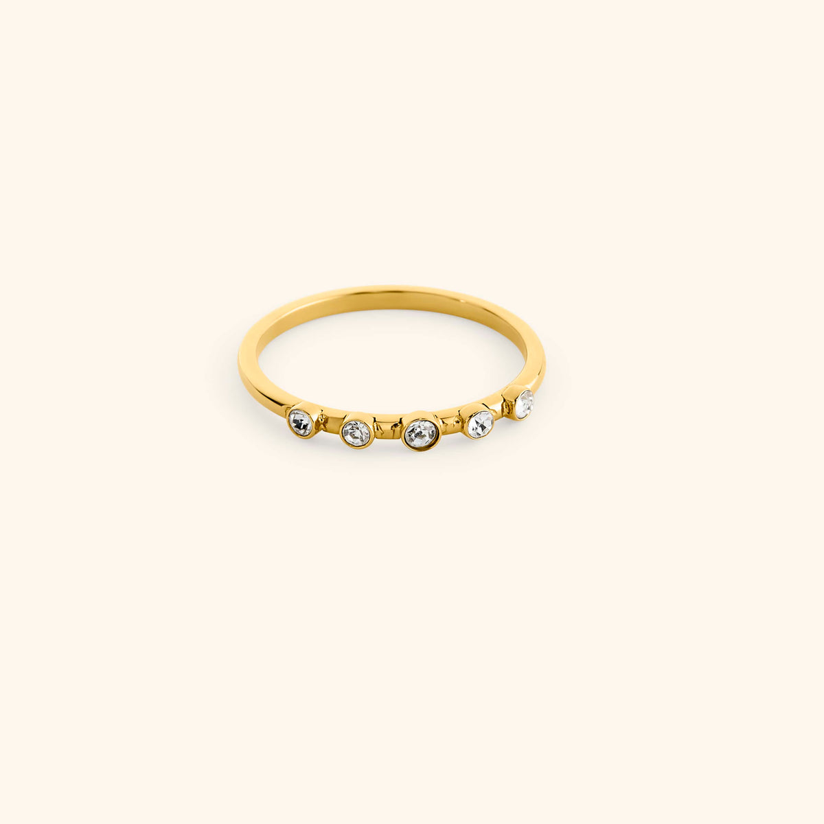 18k gold-plated Five-Stone Bezel Ring set with five round, bezel-set clear crystals across the top.