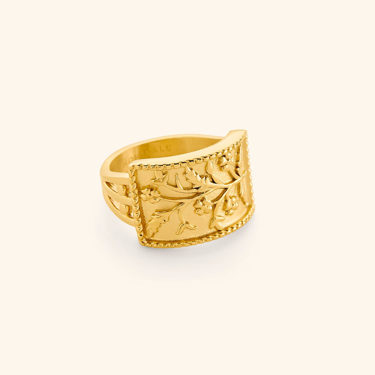 Gold Garden Ring with a rectangular face engraved with delicate floral vines.