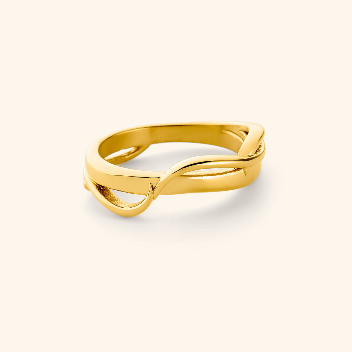 An 18k gold plated ring where two bands intertwine to form the Arabic word for love, حب. 