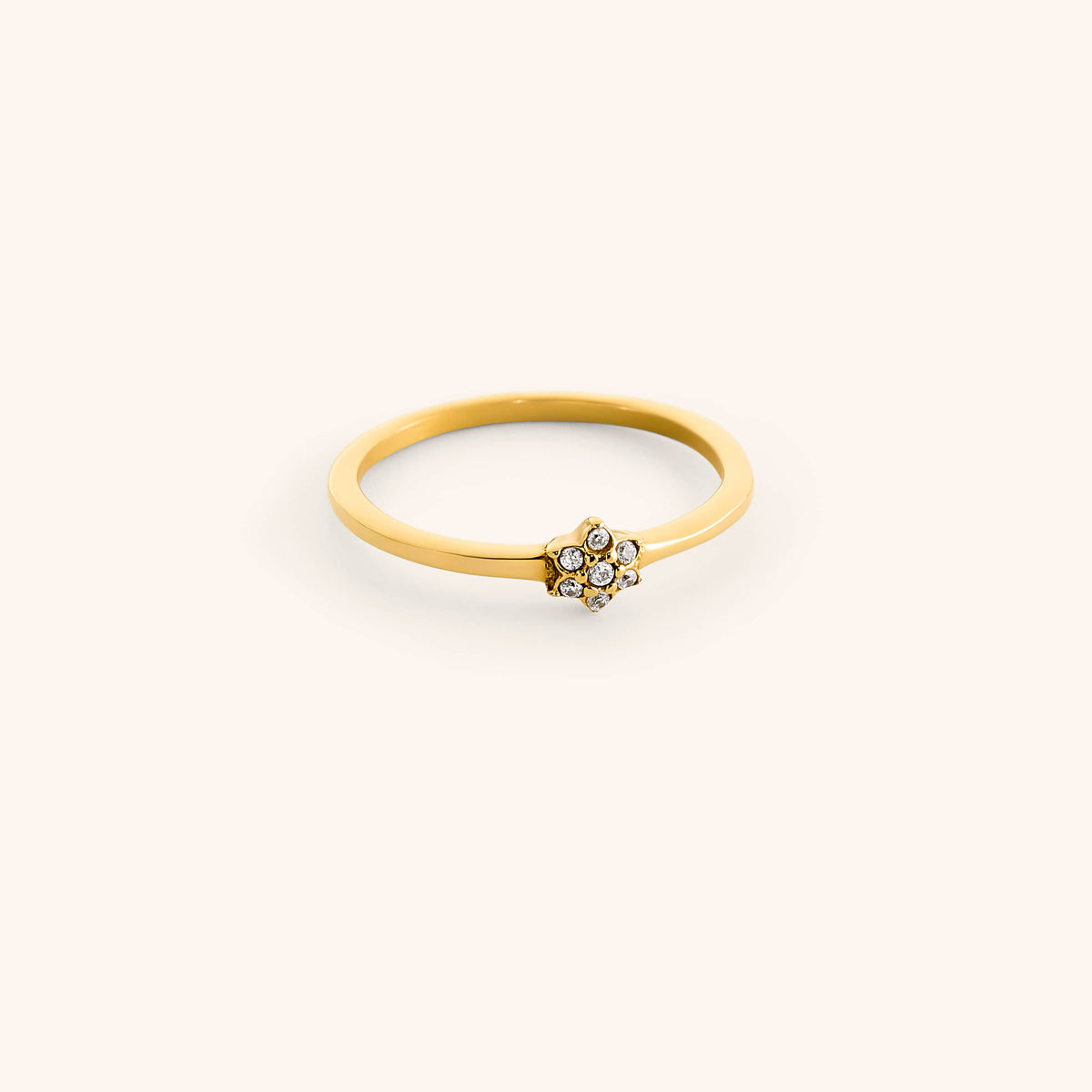 18k gold-plated Mughal Bloom Bezel Ring featuring a delicate floral cluster set with clear pavé crystals.