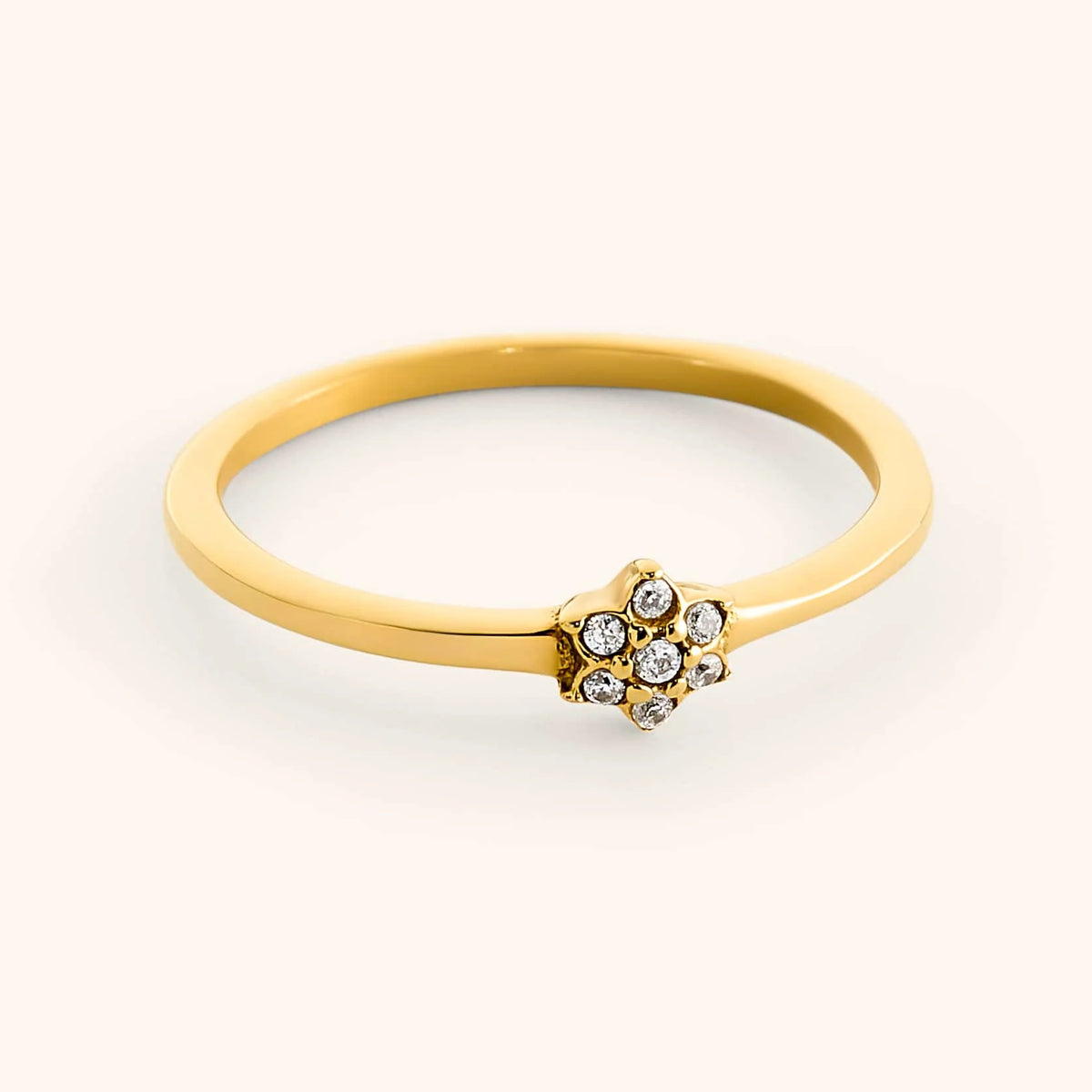 18k gold-plated Mughal Bloom Bezel Ring featuring a delicate floral cluster set with clear pavé crystals.