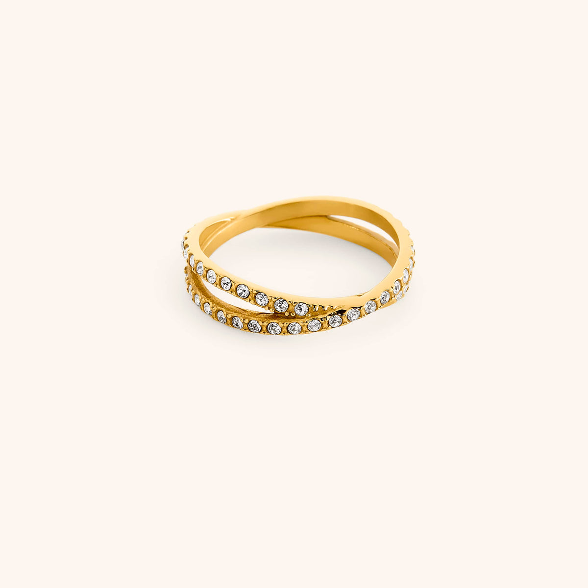 18k gold-plated Intertwined Bezel Ring featuring crisscrossing dual bands set with clear pavé crystals.