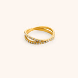 18k gold-plated Intertwined Bezel Ring featuring crisscrossing dual bands set with clear pavé crystals.