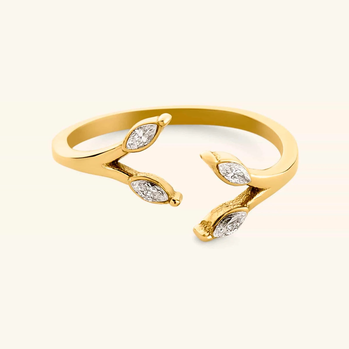 18k gold-plated Olive Branch Marquise Bezel Ring featuring an open band design with clear marquise-cut crystal leaves.