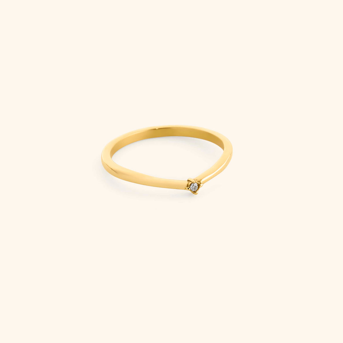 18k gold-plated Single Bezel Ring featuring a delicate, contoured band set with a single round clear crystal at the center point.