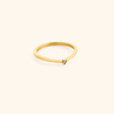 18k gold-plated Single Bezel Ring featuring a delicate, contoured band set with a single round clear crystal at the center point.