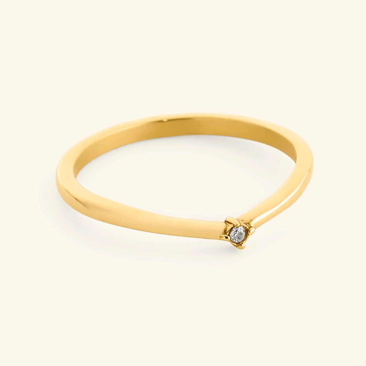18k gold-plated Single Bezel Ring featuring a delicate, contoured band set with a single round clear crystal at the center point.