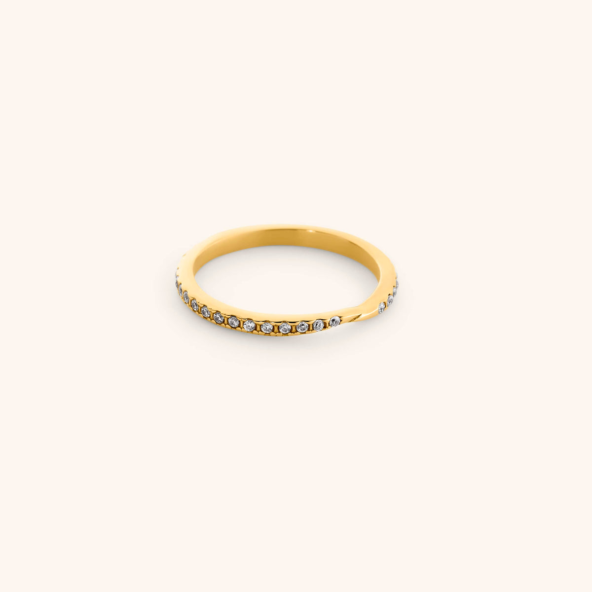18k gold-plated Bezel Band featuring a delicate, gently contoured band set with a continuous row of clear pavé crystals.