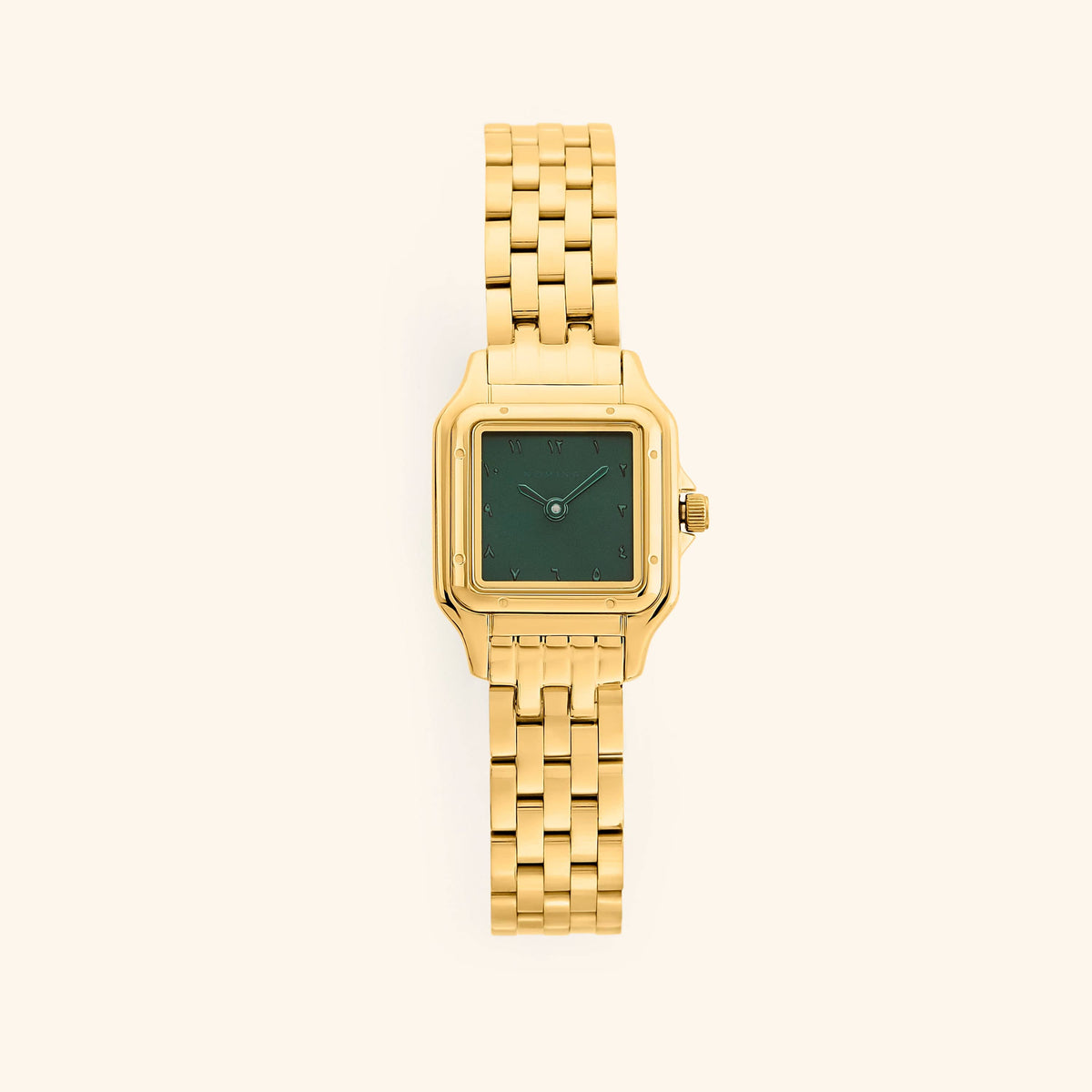An analog watch that features gold and emerald combination with a rectangular face and a monochromatic face design.
