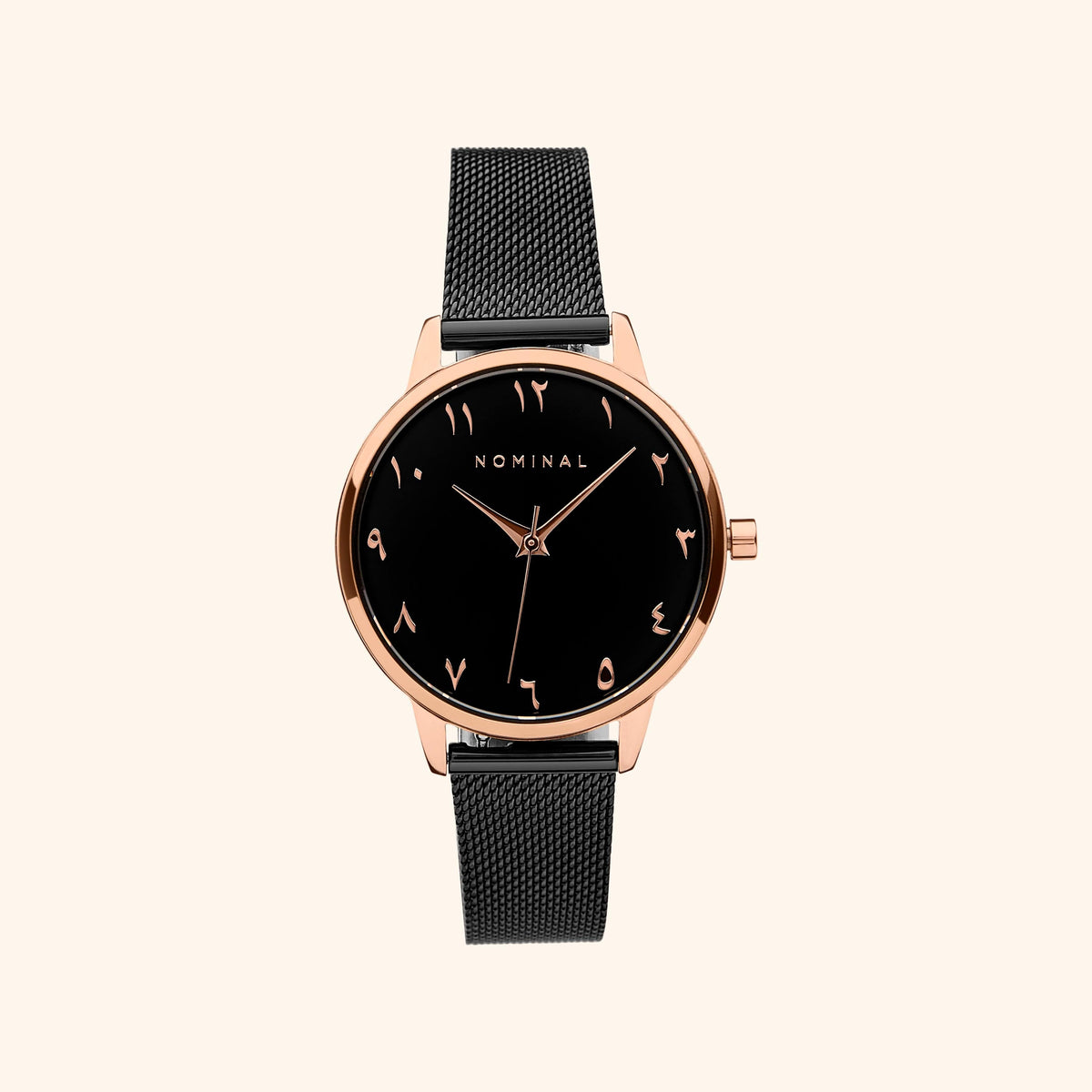 Black mesh watch with black background and rose gold details, with minimalist Arabic numerals against a neutral background. 