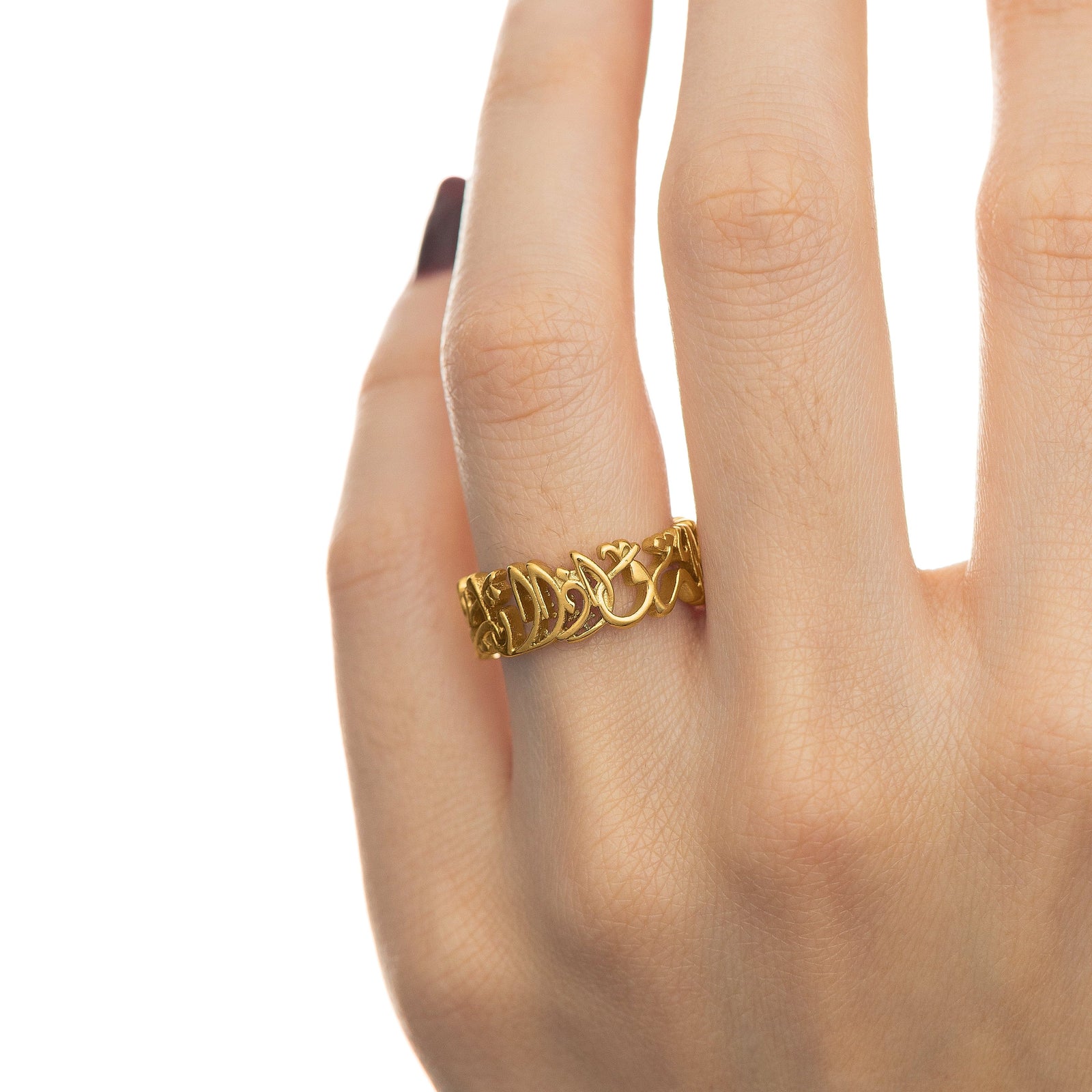 Close up photo of the gold "Walk to Me and I'll Run to You" Calligraphy Ring worn by the model.