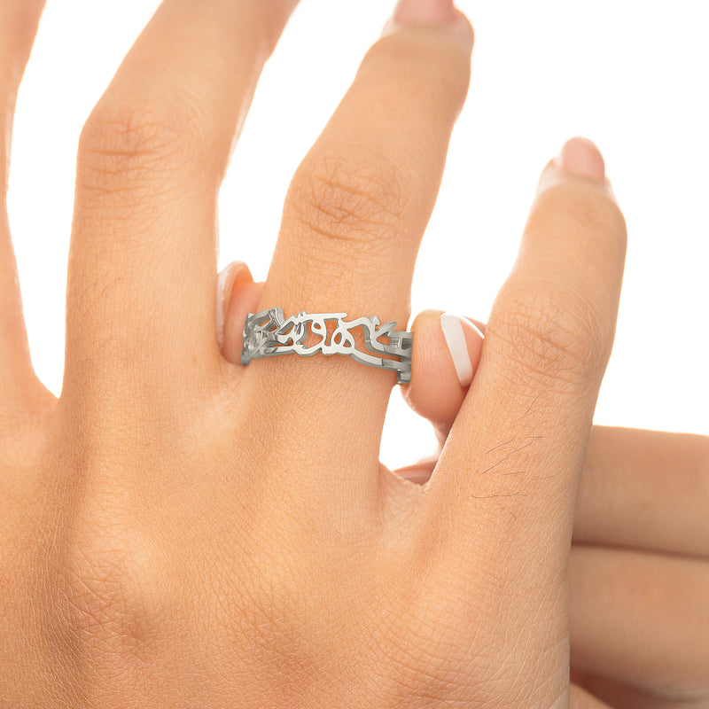 Silver “What Makes You Different Makes You Beautiful” Calligraphy Ring worn on the hand pimage_ showing the calligraphy design across the band.