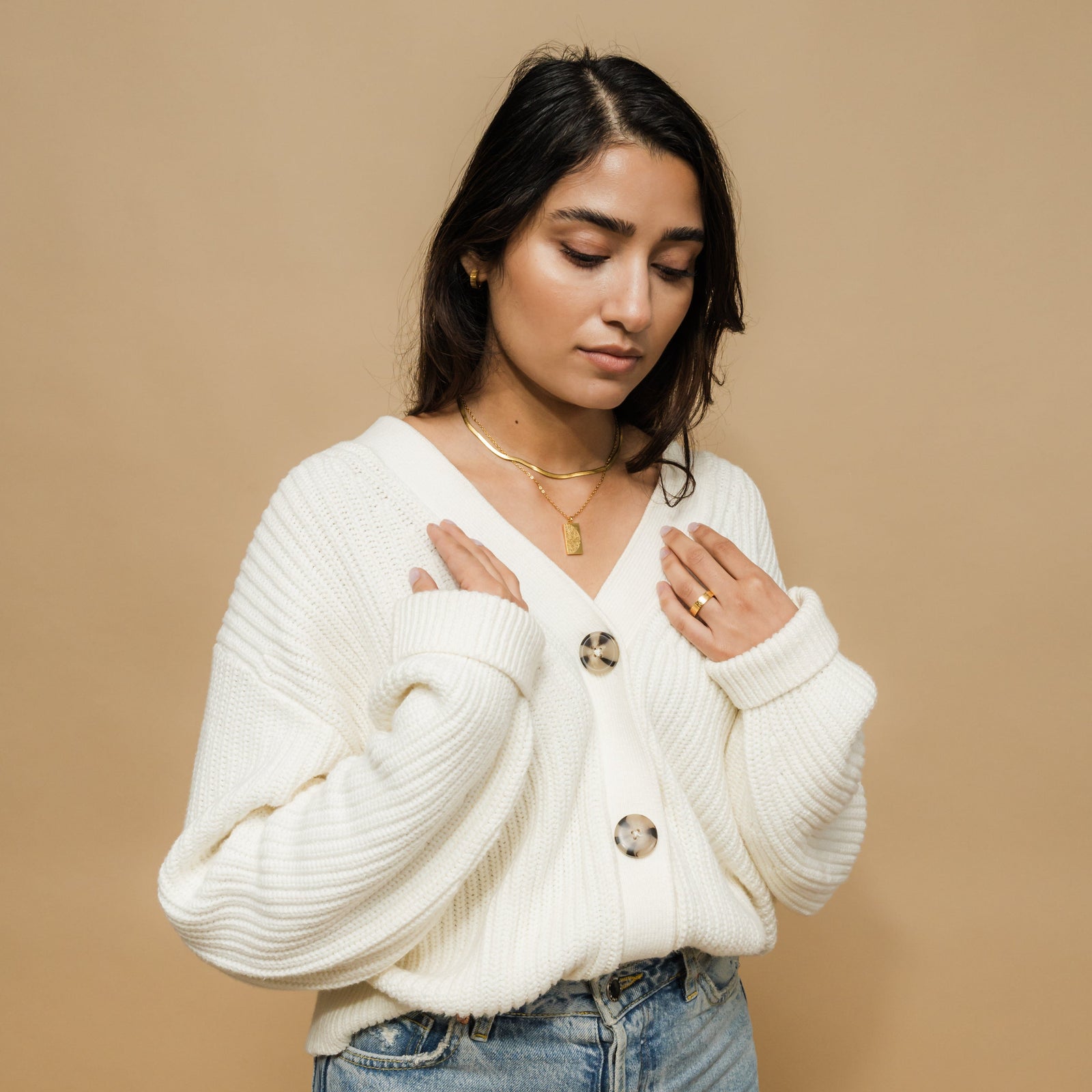 Photo of the female model wearing the gold "Tranquility in Them" Necklace | His & Hers.