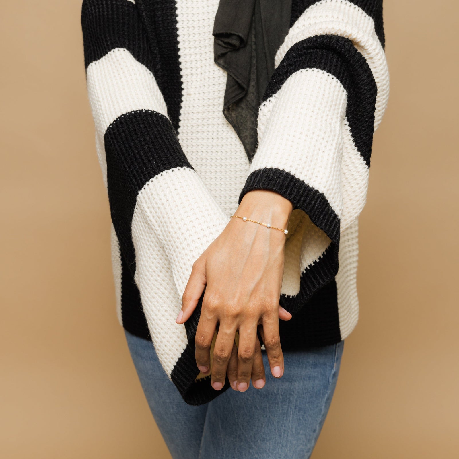 Close up of the Pearl Strand Bracelet as worn by the model.
