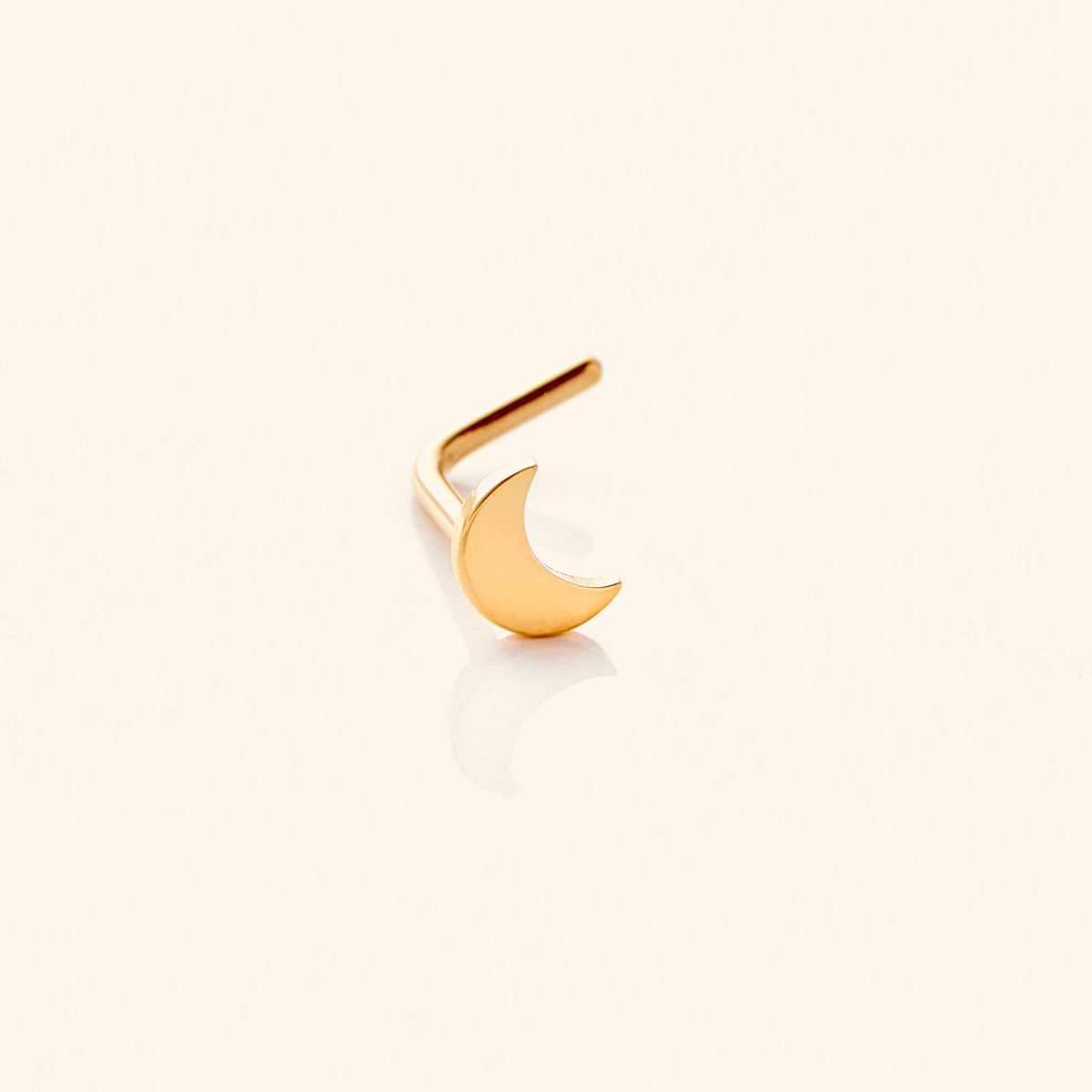 Photo of an 18k gold plated nose ring that features design of a gorgeous moon that provides light in dark times
