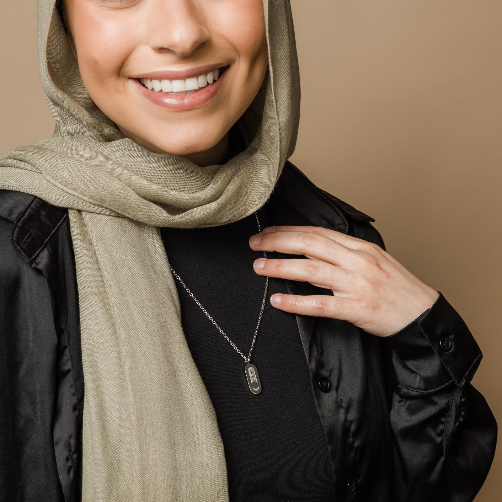 Photo of the model wearing the silver Alhamdulillah Moon Necklace | Women. 