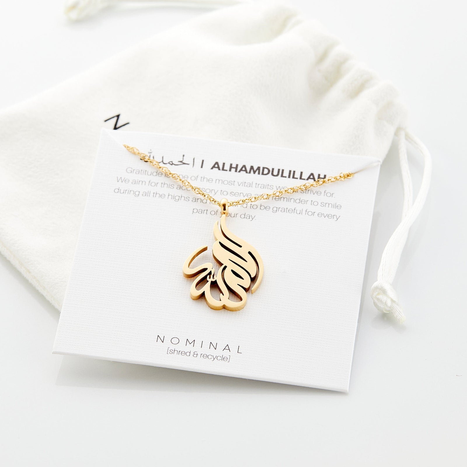 Close up of the Alhamdulillah Calligraphy Necklace on its packaging.
