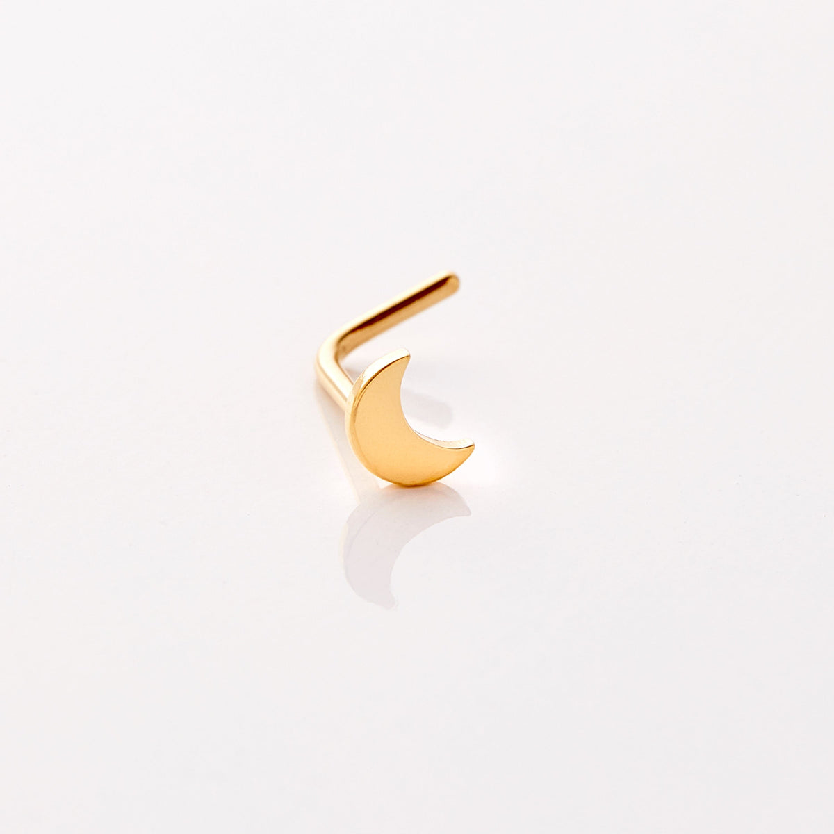 Photo of an 18k gold plated nose ring that features design of a gorgeous moon that provides light in dark times