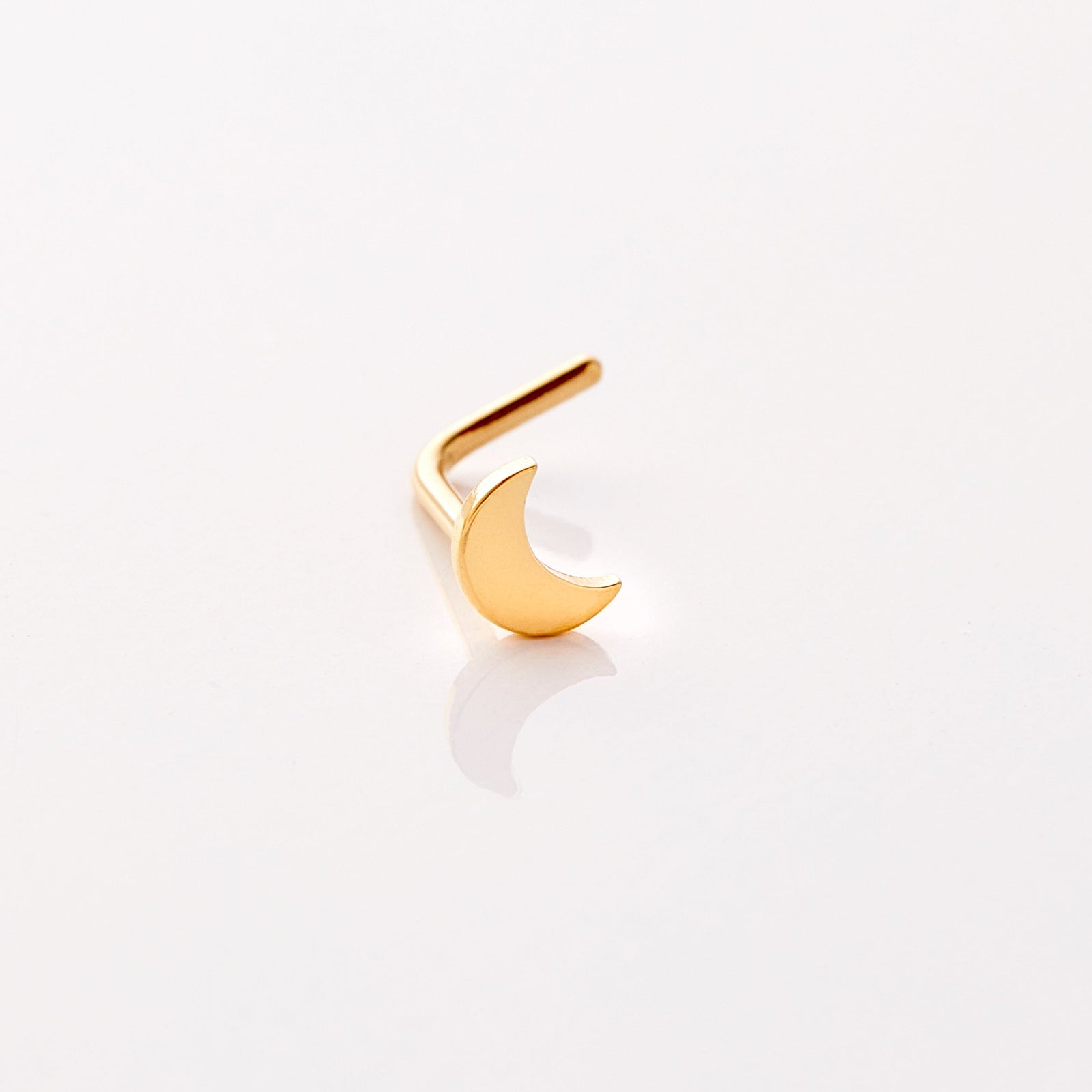 Photo of an 18k gold plated nose ring that features design of a gorgeous moon that provides light in dark times