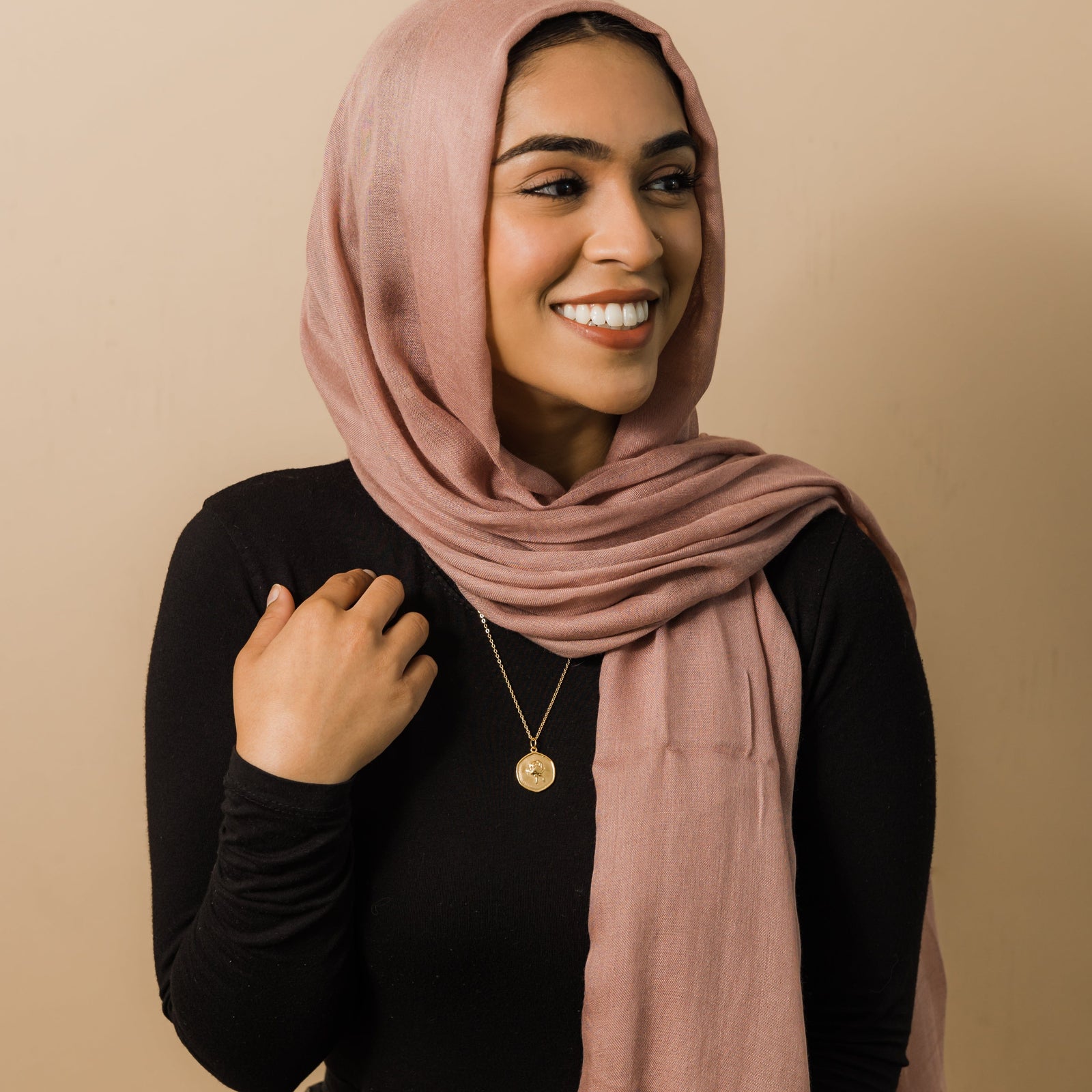 Photo of the model wearing the gold June | Birth Flower Pendant